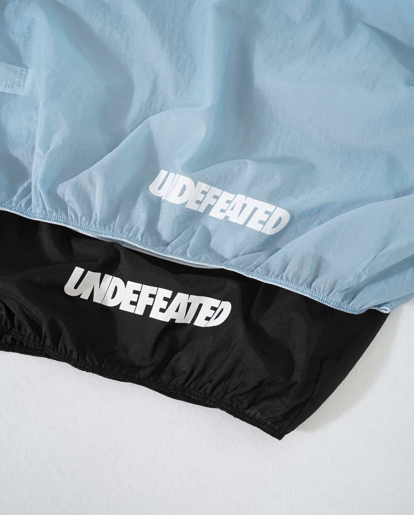 UNDEFEATED WINDCHEATER TEE 輕量防曬風衣